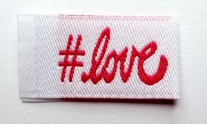 Tag-It-Ons TI013,  Tag It Bag of 12 Embroidered Sew In Garment Labels: #Love